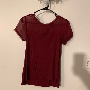 Red blouse with sheer sleeves